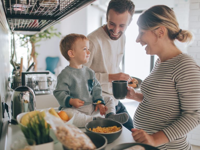 Man, pregnant woman and young child in the kitchen : Tips to speed up the house selling and house buying process by Moorhouse estate agent in Four Oaks, Sutton Coldfield.